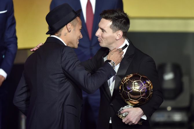 Messi is congratulated by Barcelona teammate and fellow nominee Neymar after winning the men's award for the fifth time. 