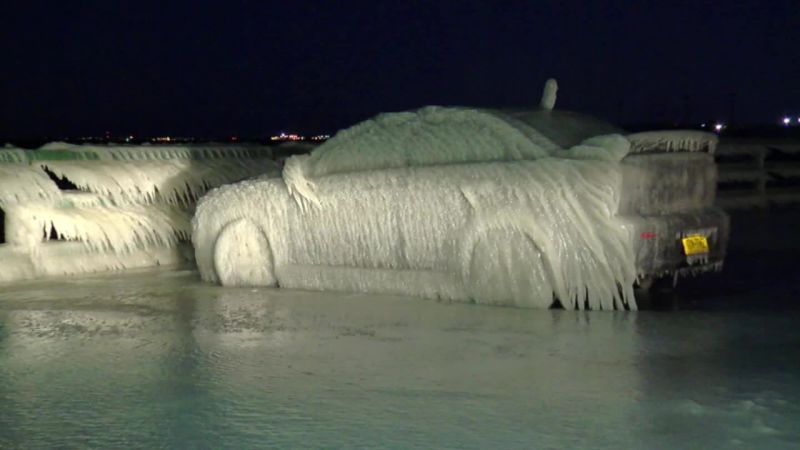 Car parked by Lake Erie is completely frozen