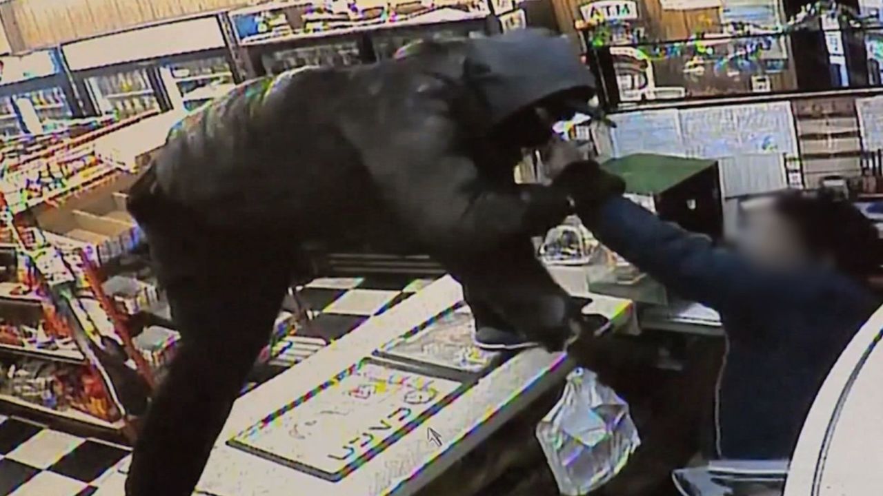 Knife-wielding robber attacks cashier | CNN