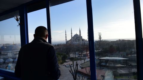 A man looks at the Blue Mosque near the site of the blast in Istanbul.