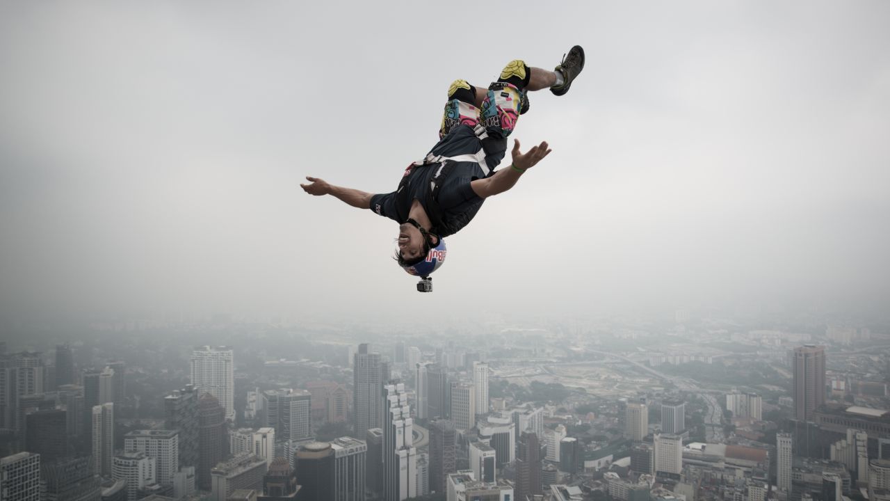 French jumper Vince Reffet leaps from the 920-foot-tall open deck of the Kuala Lumpur Tower during the annual International Tower Jump in September 2013.