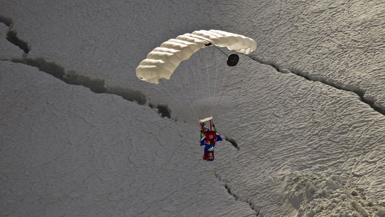 Valery Rozov prepares for landing after a wingsuit jump from the Grand Pilier d'Angle, a nearly 14,000-foot-tall buttress on the southern side of Mont Blanc in July 2011.