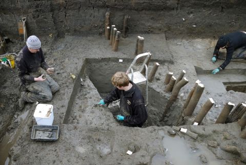 A recent excavation in eastern England has unearthed what is believed to be the best-preserved Bronze Age village found in Britain. Pictured is the excavation of the structure's palisade -- posts encircling the dwelling site -- during the exploratory investigation in 2006.