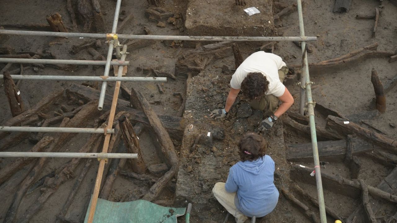 Excavating the site. Removal of river silts to expose the wood.