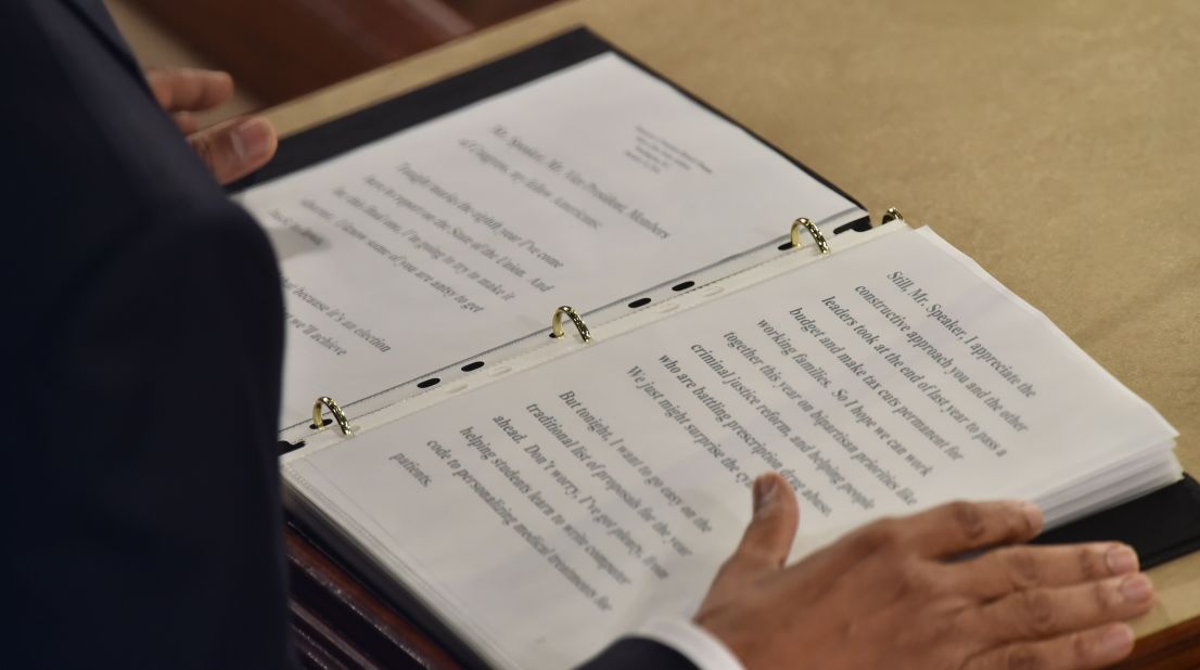 Obama reads from the text of his State of the Union address.