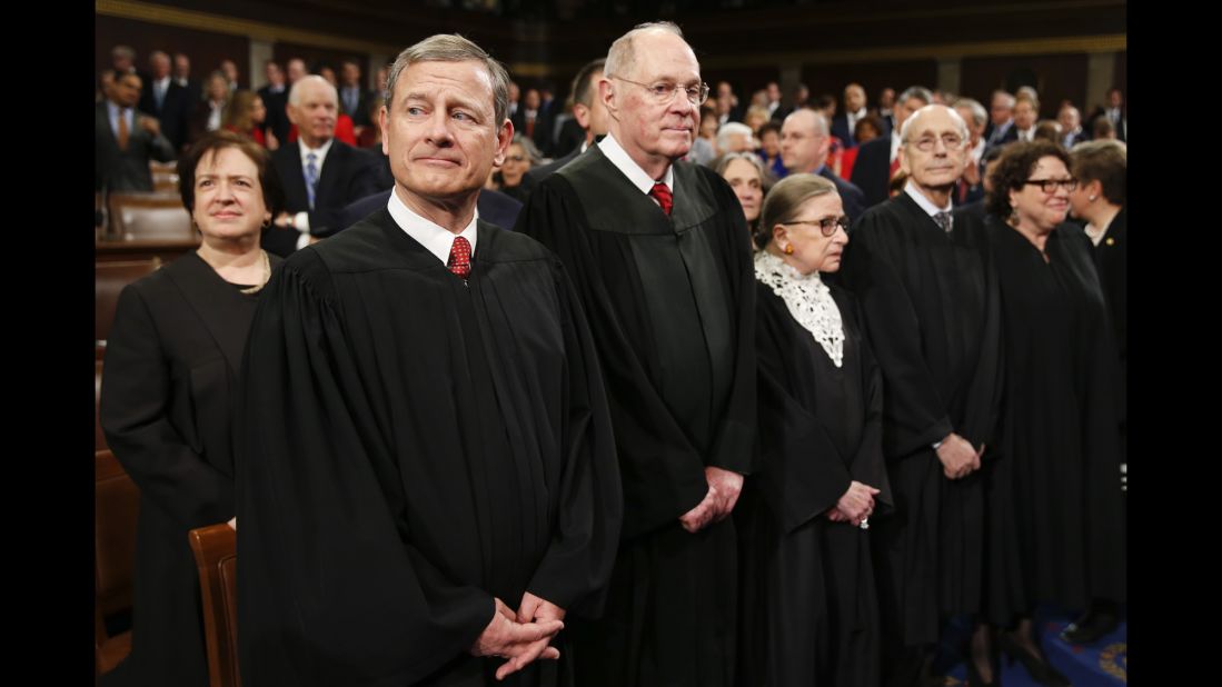 Supreme Court Justice Elena Kagan, from left, Chief Justice John Roberts, Justice Anthony Kennedy, Justice Ruth Bader Ginsburg, Justice Stephen Breyer and Justice Sonia Sotomayor wait for Obama to arrive.
