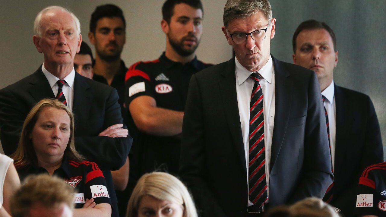 Essendon legend Simon Madden (second right) listens on to a press conference at his club on January 12, 2016 in Melbourne, Australia. The Court of Arbitration for Sport found the 34 past and present Essendon players guilty of doping.