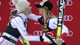 Winner Lara Gut (R) from Switzerland embraces second-placed Lindsey Vonn (L) from the US during the podium ceremony after competing in the FIS Alpine World Cup Women Super Combined on December 18, 2015 in Val d'Isere, French Alps. / AFP / PHILIPPE DESMAZES        (Photo credit should read PHILIPPE DESMAZES/AFP/Getty Images)