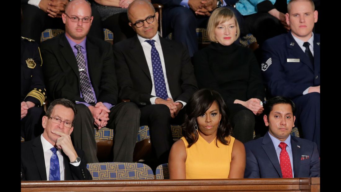 First lady Michelle Obama sits next to a vacant seat to honor victims of gun violence during President Barack Obama's final State of the Union address on Tuesday, January 12. Connecticut Gov. Dannel Malloy is at left and Army veteran Naveed Shah is at right. Behind them, from left, are activist Ryan Reyes, Microsoft CEO Satya Nadella, community college student Jennifer Bragdon and Air Force Staff Sgt. Spencer Stone.