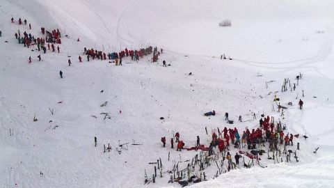 Scores of rescuers converged on the site of Wednesday's avalanche in the French Alps.