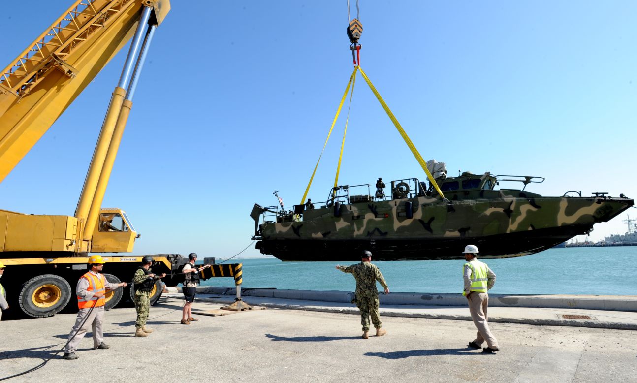 Sailors prepare to launch one of the riverine command boats into the Persian Gulf for the first time in December 2011.