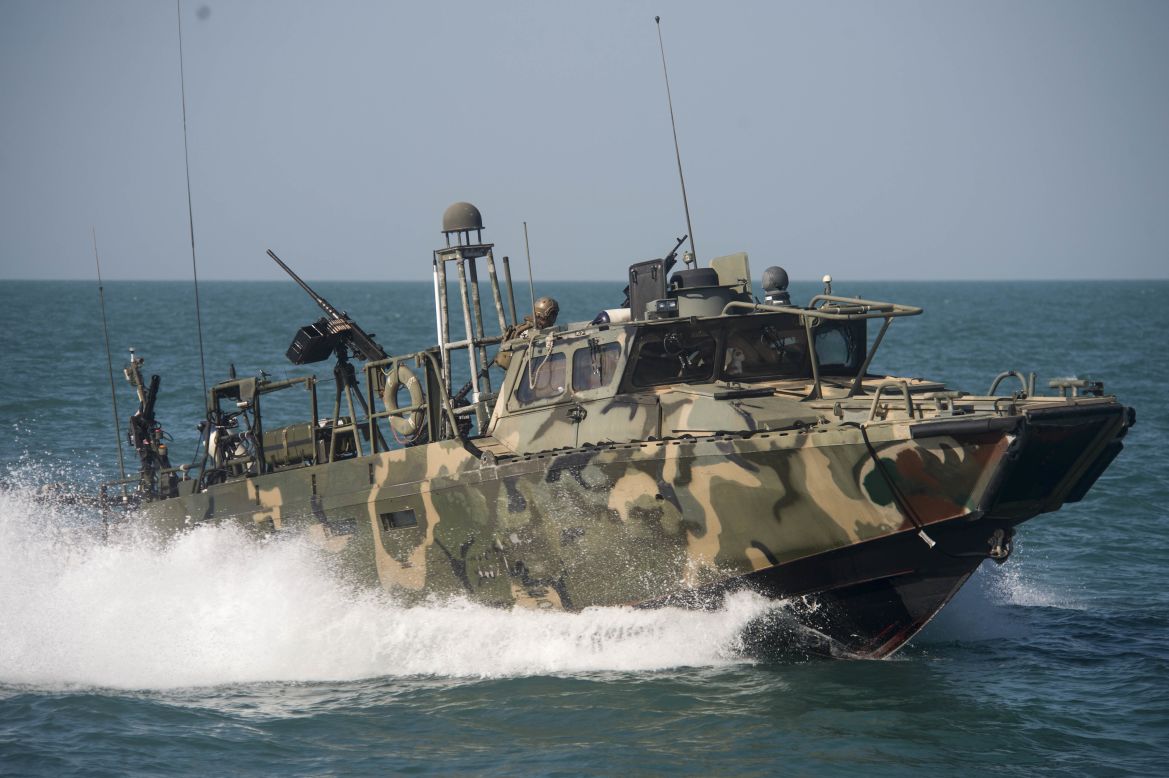 A U.S. boat patrols the Gulf on October 26. Riverine command boats were originally used in shallow-water and tropic environments, but these boats have been repurposed for open-sea patrol.