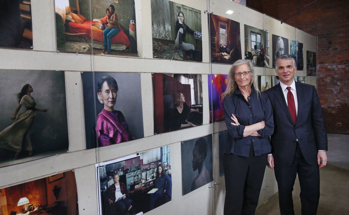  Annie Leibovitz stands with Sergio P Ermotti, Group CEO, UBS at the launch of the 'WOMEN:New Portraits' exhibition at Wapping Hydraulic Power Station.