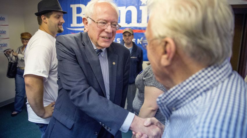 Democratic presidential candidate Sen. Bernie Sanders, seen here shaking hands, shares the same economic philosophy as the Rev. Martin Luther King, Jr., some say.
