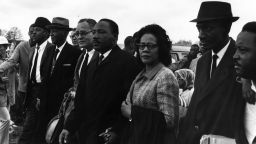 Martin Luther King Jr. joins wife Coretta Scott King during march from Selma, Alabama to the state capital in Montgomery in March 1965.