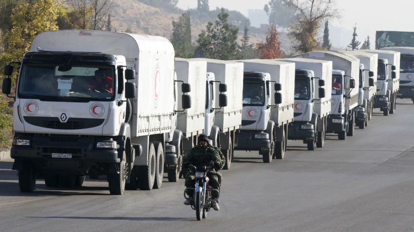 A convoy of aid from the Syrian Arab Red Crescent leaves the capital Damascus for the besieged rebel-held Syrian town of Madaya, on January 14, 2016.