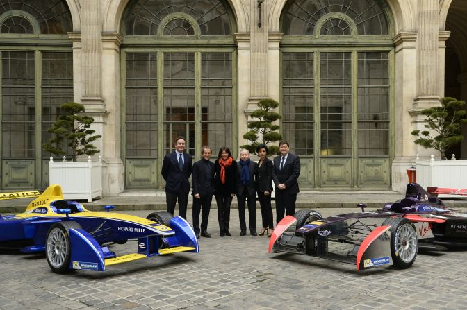 From left to right: Formula E CEO Alejandro Agag (left), former Formula One world champion Alain Prost, Paris' Mayor Anne Hidalgo, FIA president Jean Todt, Paris' 7th district mayor Rachida Dati and French minister for Urban Affairs, Youth and Sport Patrick Kanner pose next to Formula E cars after a press conference to present the French stage of the Formula E championship, on January 13, 2016 in Paris. 