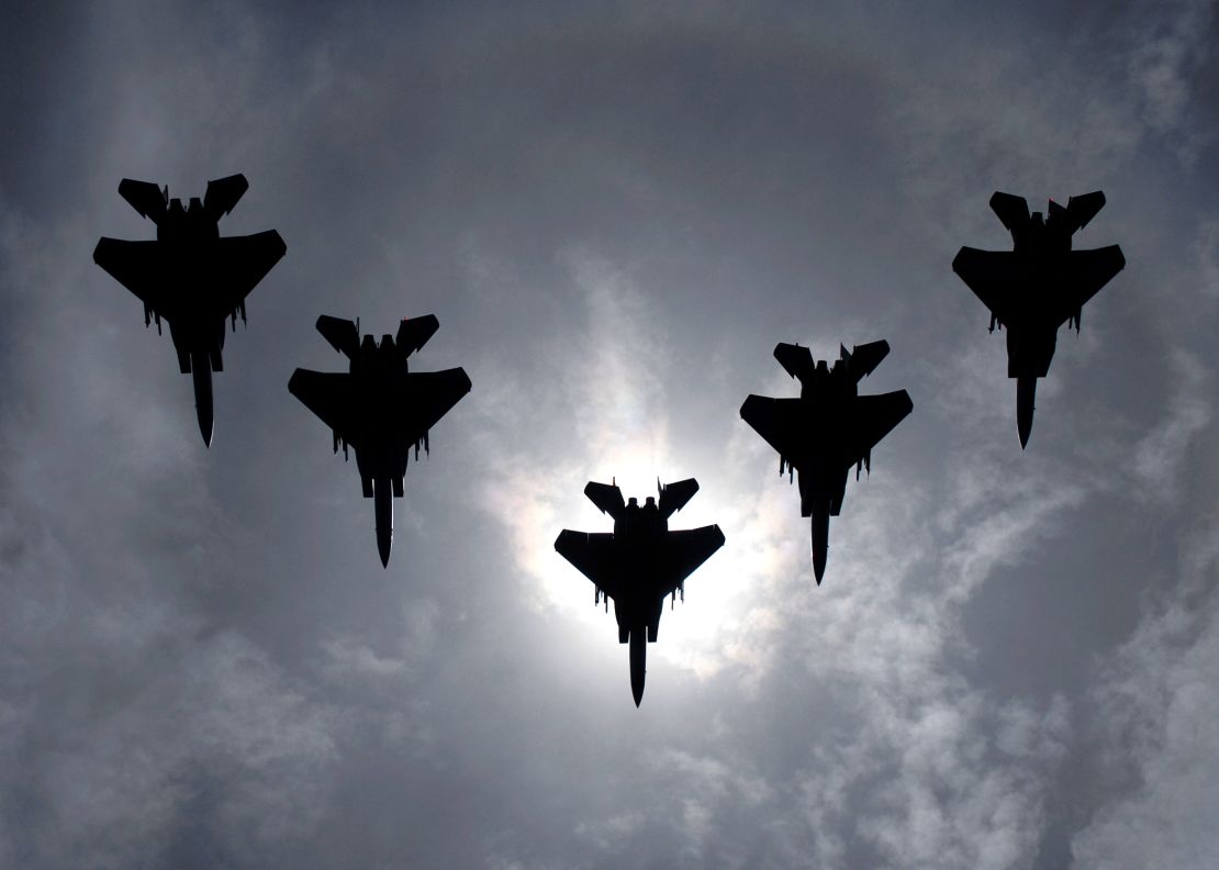 A flight of F-15C Eagles from the 44th Fighter Squadron flies during a solar eclipse in Japan on July 22.
