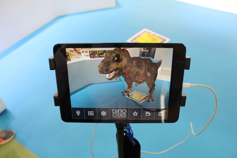 ...only to find a DNA barcode, which triggers -- in the manufacturer's complementary mobile app -- an animation of the same dinosaur whose bones you've just excavated. The app allows players to take photos and videos posing with the computer-generated creature.