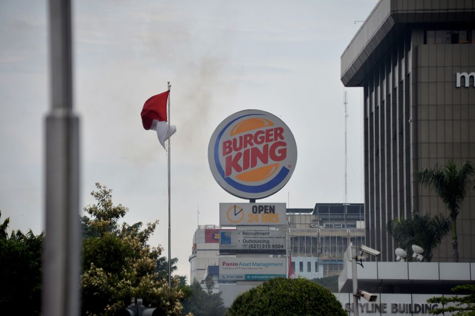 Smoke rises following a series of blasts outside a shopping center in Jakarta on January 14.