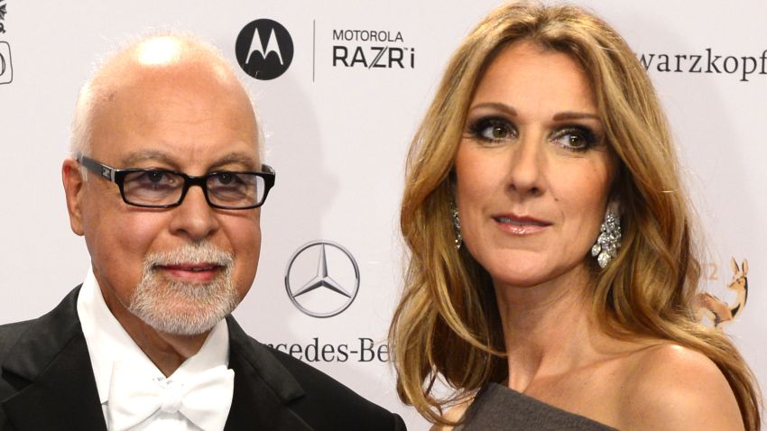 Canadian singer Celine Dion (R) and her husband Rene Angelil pose for photographers as they arrive on the red carpet for the Bambi awards in Duesseldorf, western Germany, on November 22, 2012. The Bambis are the main German media awards. AFP PHOTO / JOHN MACDOUGALL        (Photo credit should read JOHN MACDOUGALL/AFP/Getty Images)
