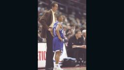 30 Dec 1996:  Guard Tyrone Bogues and coach Dave Cowens of the Charlotte Hornets speak to each other during a game against the Washington Bullets at the US Air Arena in Landover, Maryland.  The Hornets won the game 101-92. Mandatory Credit: Doug Pensinger  /Allsport