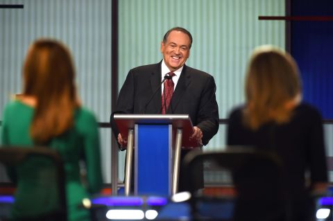 Huckabee laughs during the debate, which was hosted by the Fox Business Network. His opening statement was much more serious. "There are a lot of people who are hurting today," said the former Arkansas governor. "I wish the President knew more of them. He might make a change in the economy and the way he's managing it."
