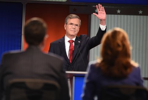 Bush waves to the audience. The former Florida governor has been trying to build momentum that he had in the early stages of his candidacy, and he went after Democratic candidate Hillary Clinton early in the debate. "She's under investigation with the FBI right now," he said. "If she gets elected, her first 100 days, instead of setting an agenda, she might be going back and forth between the White House and the courthouse. We need to stop that."