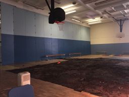 Part of the warped floor was pulled up but not replaced, leaving students without a gym.