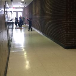 Children play in the hallway because the gym and the playground are closed.