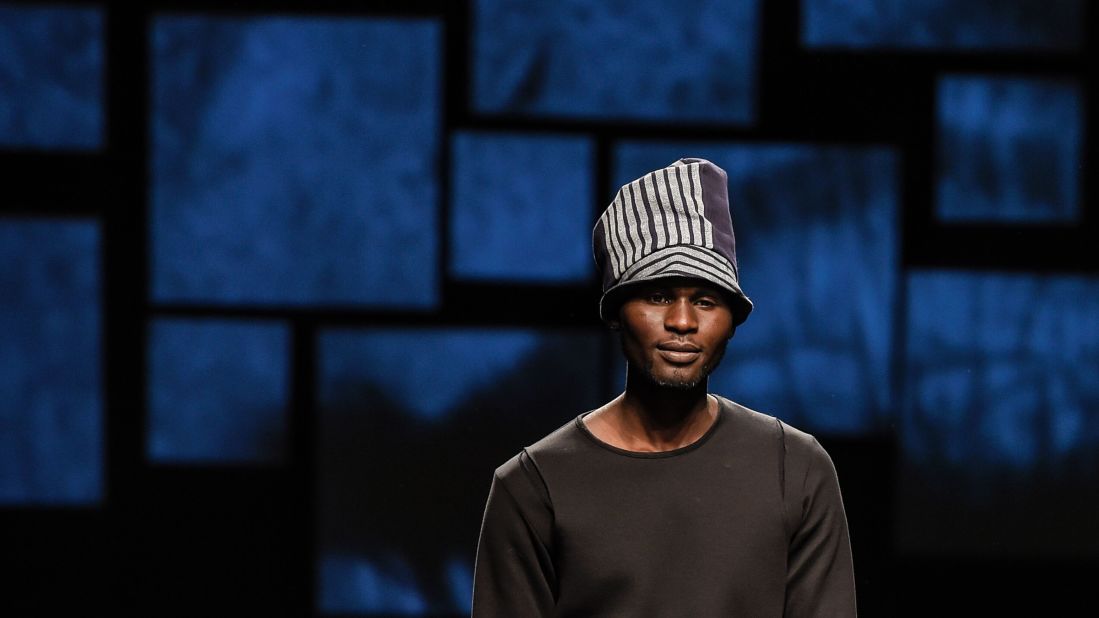 Three African asylum seekers took to the runway this week at Pitti Immagine Uomo 89. Here, one model walks for African-designed fashion brand U.mi-1. 