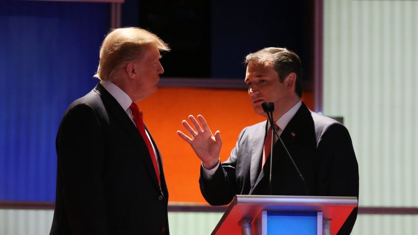 Donald Trump (left) and Sen. Ted Cruz speak during a commercial break in the Fox Business Network Republican presidential debate at the North Charleston Coliseum and Performing Arts Center on January 14, 2016, in North Charleston, South Carolina.