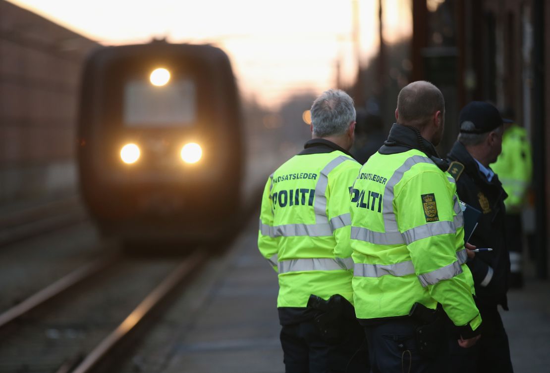 Danish police in Padborg prepare to board a train from Germany to check passengers' identity papers.