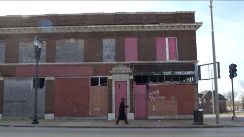 Boarded up buildings sit on Martin Luther King Drive.