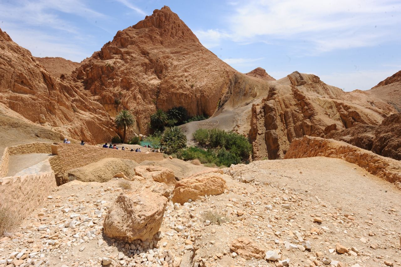 In Tunisia, North Africa, 99% of residents have access to the electric grid, 90% have piped water and 79% have tarred or paved roads. 