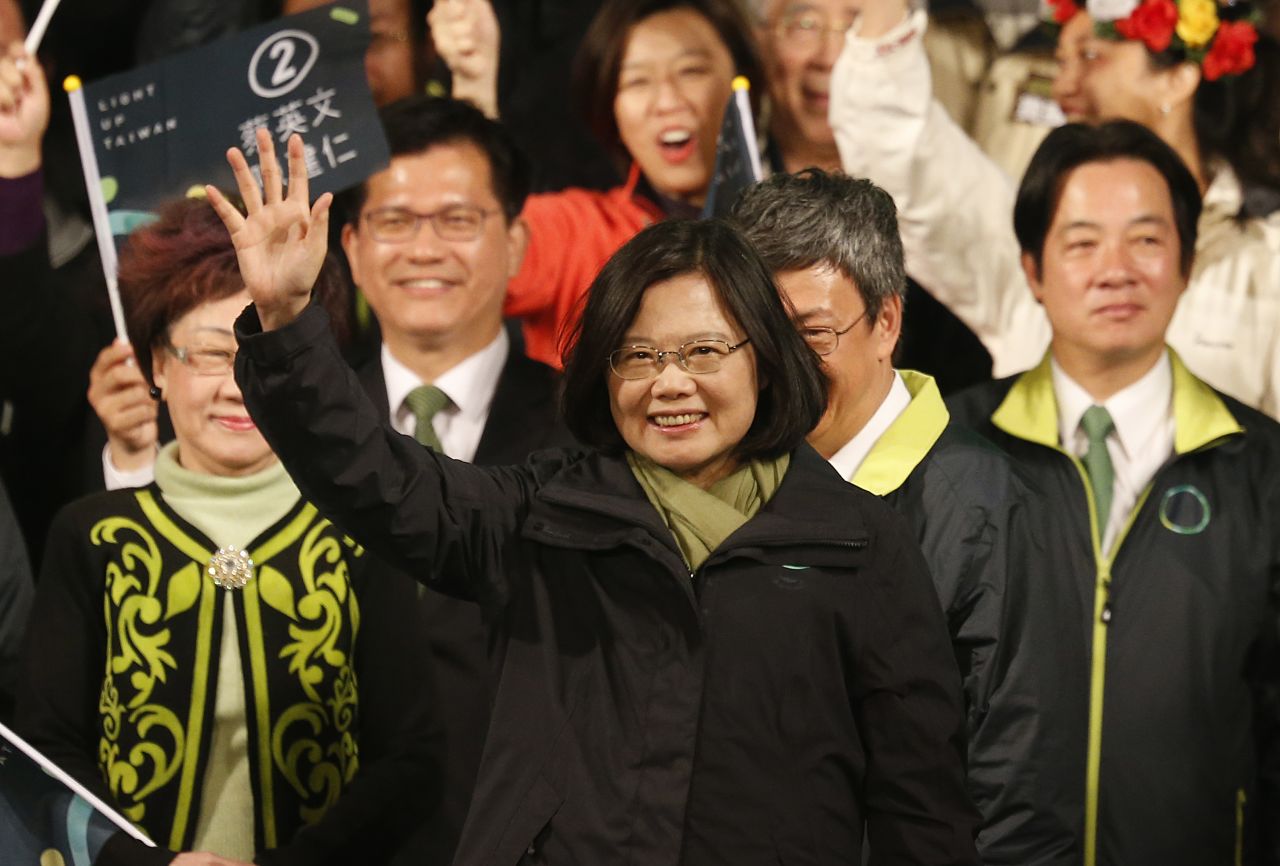 Democratic Progressive Party candidate Tsai Ing-wen raises her hands as she declares victory in the presidential election on Saturday, January 16 in Taipei.