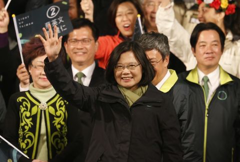 Democratic Progressive Party candidate Tsai Ing-wen raises her hands as she declares victory in the presidential election on Saturday, January 16 in Taipei.