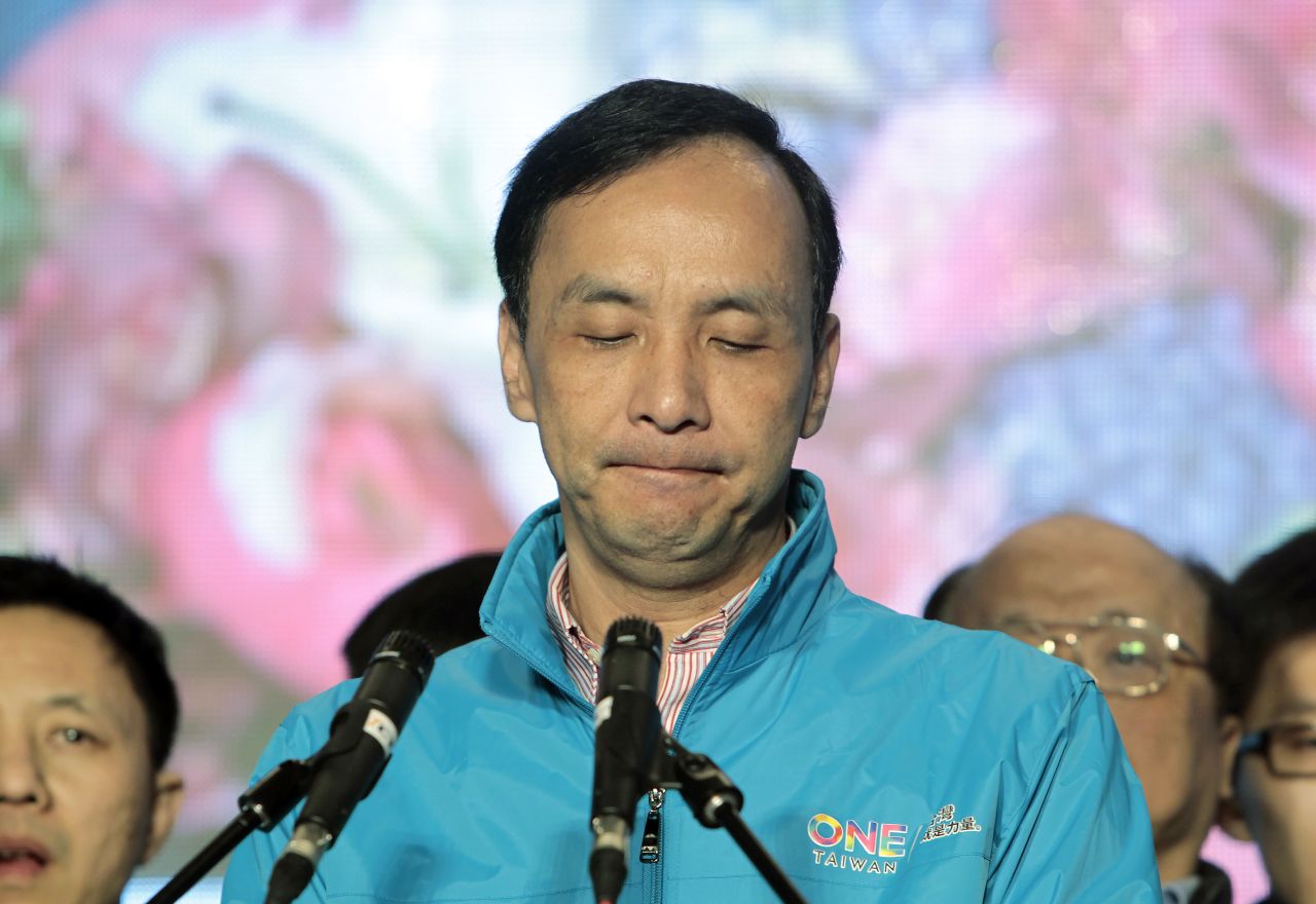 Taiwan's ruling Nationalist Party candidate Eric Chu delivers a speech as he concedes in the presidential election. 