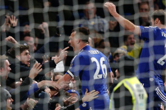 John Terry celebrates with Chelsea fans after scoring a 98th-minute goal to deny Everton on Saturday. 