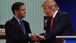 Republican Presidential candidates, businessman Donald Trump (R) and Florida Senator Marco Rubio shake hands after the Republican Presidential debate sponsored by Fox Business and the Republican National Committee at the North Charleston Coliseum and Performing Arts Center in Charleston, South Carolina on January 14, 2016. 