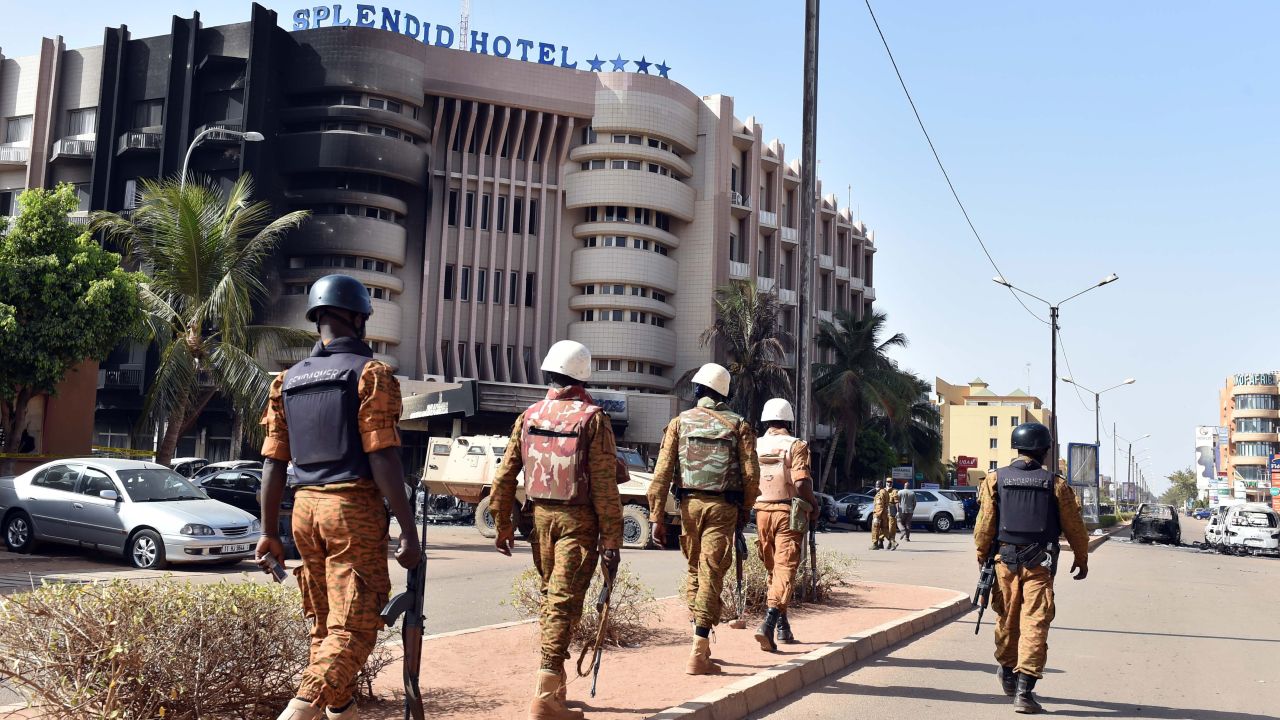 Burkina Faso's troops patrol outside the Splendid Hotel and nearby Cappuccino restaurant following a jihadist attack in Ouagadougou on January 16, 2016.