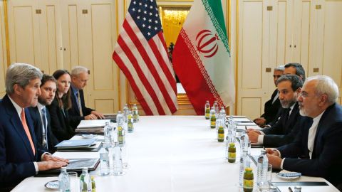 US Secretary of State John Kerry (L)  meets with Iranian Foreign Minister Javad Zarif (R) in Vienna, Austria on January 16, 2016, on what is expected to be "implementation day,"  the day the International Atomic Energy Agency (IAEA) verifies that Iran has met all conditions under the nuclear deal.  
 / AFP / POOL / KEVIN LAMARQUE        (Photo credit should read KEVIN LAMARQUE/AFP/Getty Images)