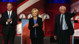 Democratic presidential candidate, former Maryland Gov. Martin O'Malley , left, Democratic presidential candidate, Hillary Clinton and Democratic presidential candidate, Sen. Bernie Sanders, I-Vt,  stand together before the start of the NBC, YouTube Democratic presidential debate at the Gaillard Center, Sunday, Jan. 17, 2016, in Charleston, S.C. (AP Photo/Stephen B. Morton)