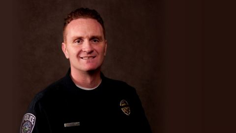 Officer Douglas Barney, 44, was taken to a hospital, where he died of his injuries.
