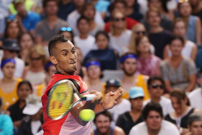 Australian Nick Kyrgios blitzed Spain's Pablo Carreno Busta 6-2 7-5 6-2 to cruise into the second round.