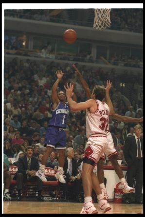 Bogues showcases his extraordinary vertical reach during a Hornets game against the Chicago Bulls in 1994. He defied his small stature and was able to jump 44 inches, among the highest figures in NBA history.