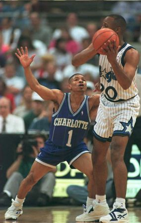 "Down here!" Bogues tries in vain to oppose guard Brian Shaw of the Orlando Magic.