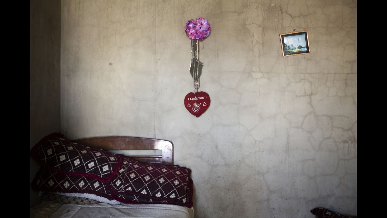 A heart hangs over a bed at a refugee camp in the Bekaa Valley.