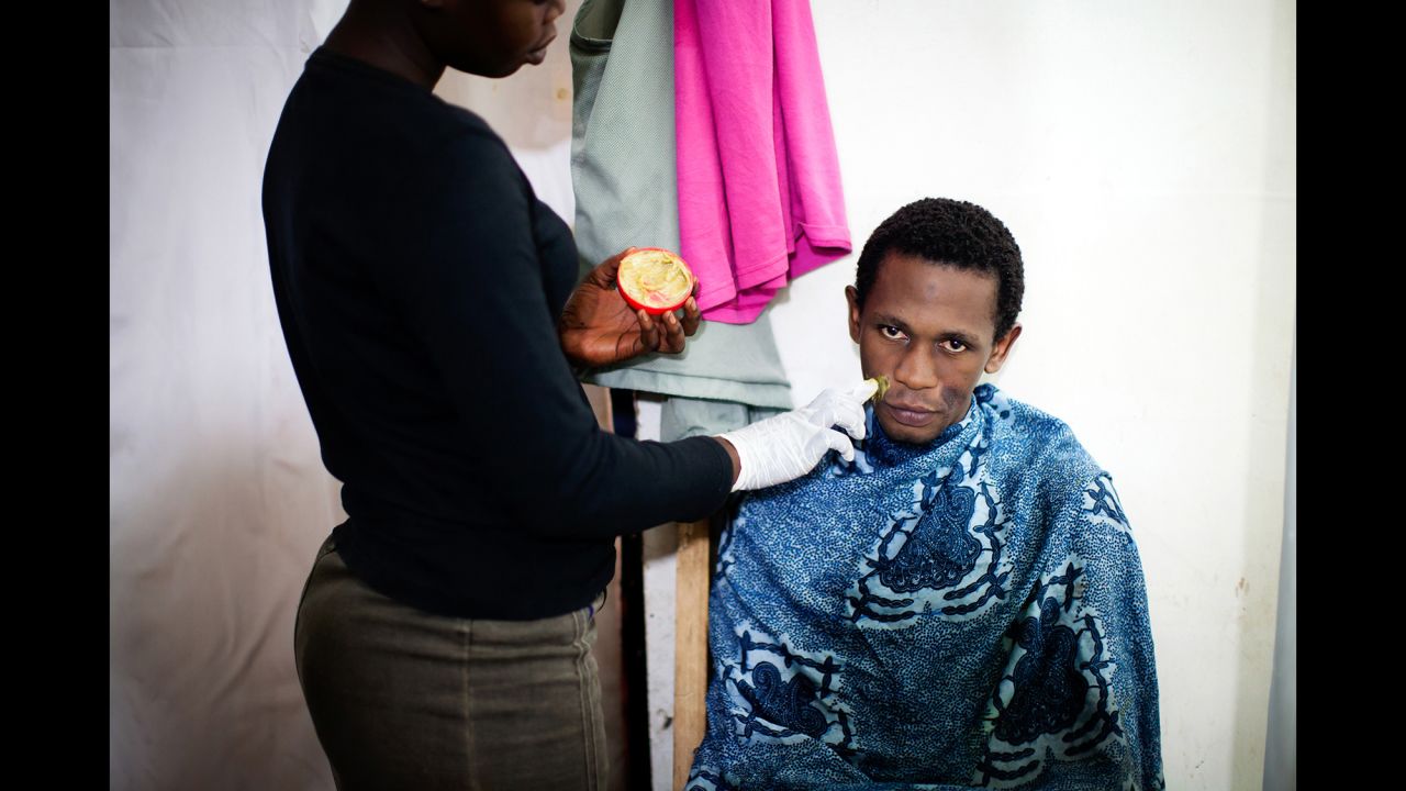 Mama Lususu also has male clients. Hussein, seen here, comes for stain treatment and for bleaching.