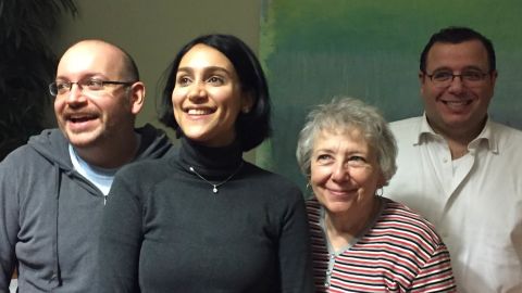 The Washington Post's Jason Rezaian, left, reunites with his family in Germany.